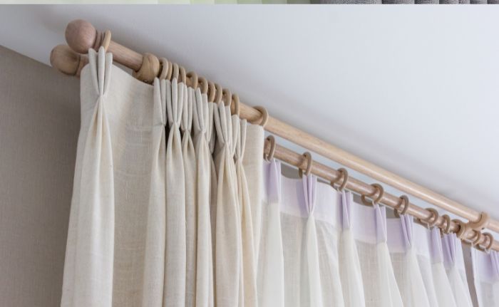 Pleated curtains on a rail